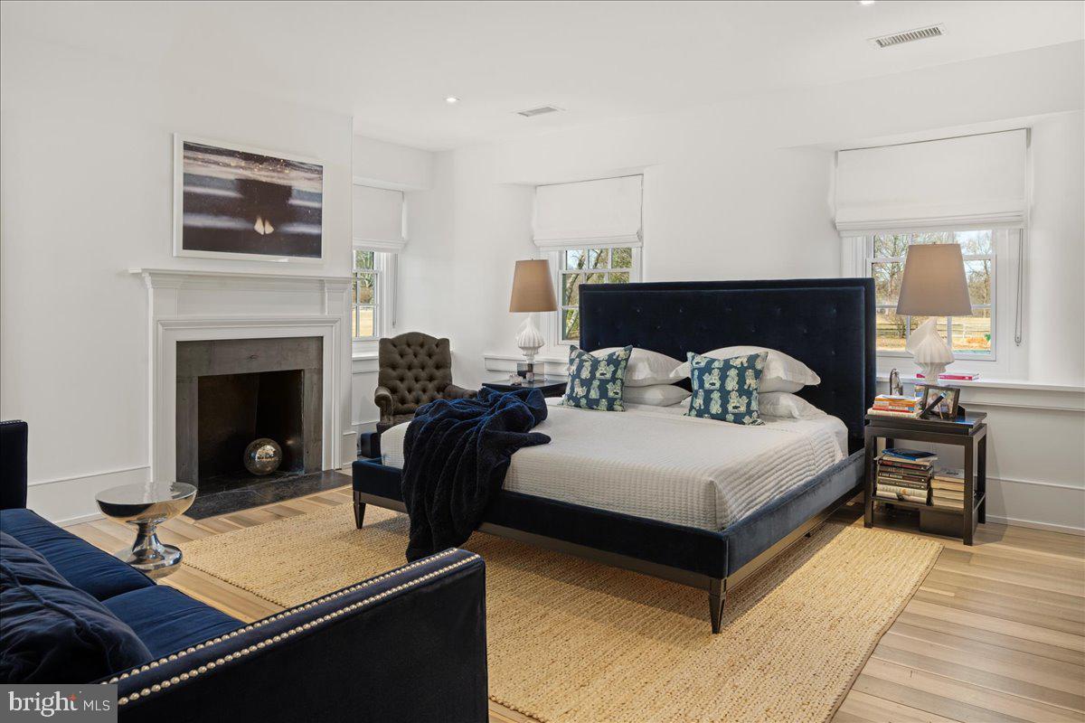 864 Grubbs Mill Road Newtown Square, PA 19073 - Photo 22 of 50 a bedroom with a bed and a fireplace
