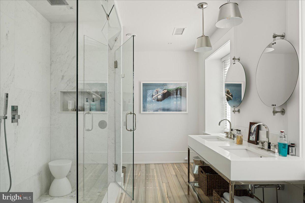 864 Grubbs Mill Road Newtown Square, PA 19073 - Photo 23 of 50 a bathroom with a sink a toilet and shower