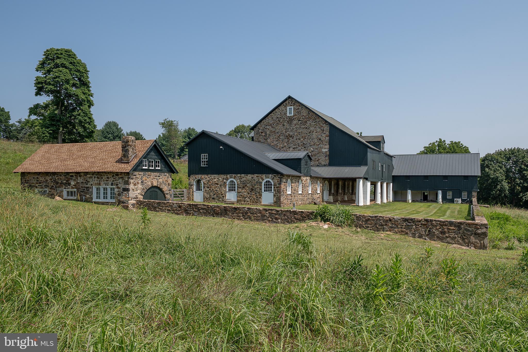 864 Grubbs Mill Road Newtown Square, PA 19073 - Photo 31 of 50 front view of a house with a yard
