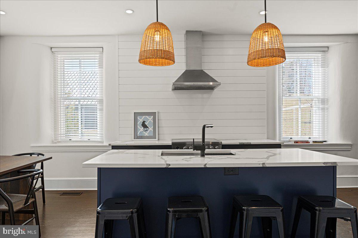 864 Grubbs Mill Road Newtown Square, PA 19073 - Photo 39 of 50 a kitchen with a sink a window and chairs