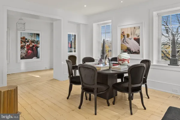 a dining room with furniture and window