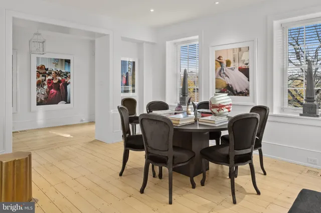 a dining room with furniture and window