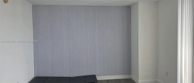 a kitchen with stainless steel appliances a sink stove and microwave