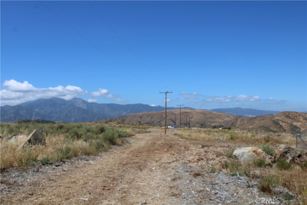 0 Candy Lane Perris, CA 92570 - Photo 16 of 23 a view of a yard with a mountain