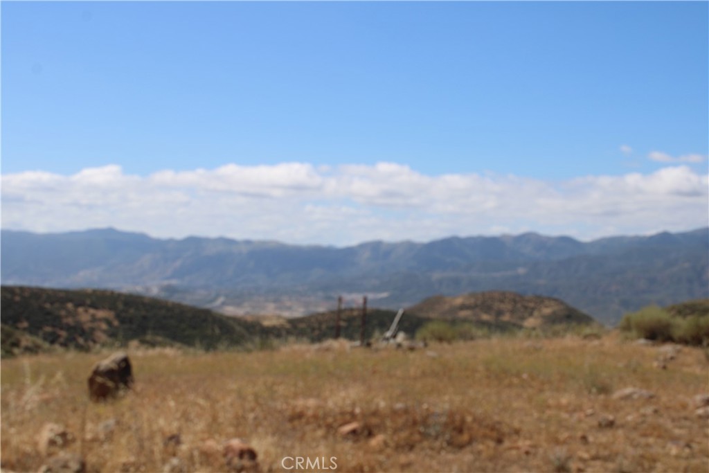 0 Candy Lane Perris, CA 92570 - Photo 6 of 23 a view of a lake with mountains in the background