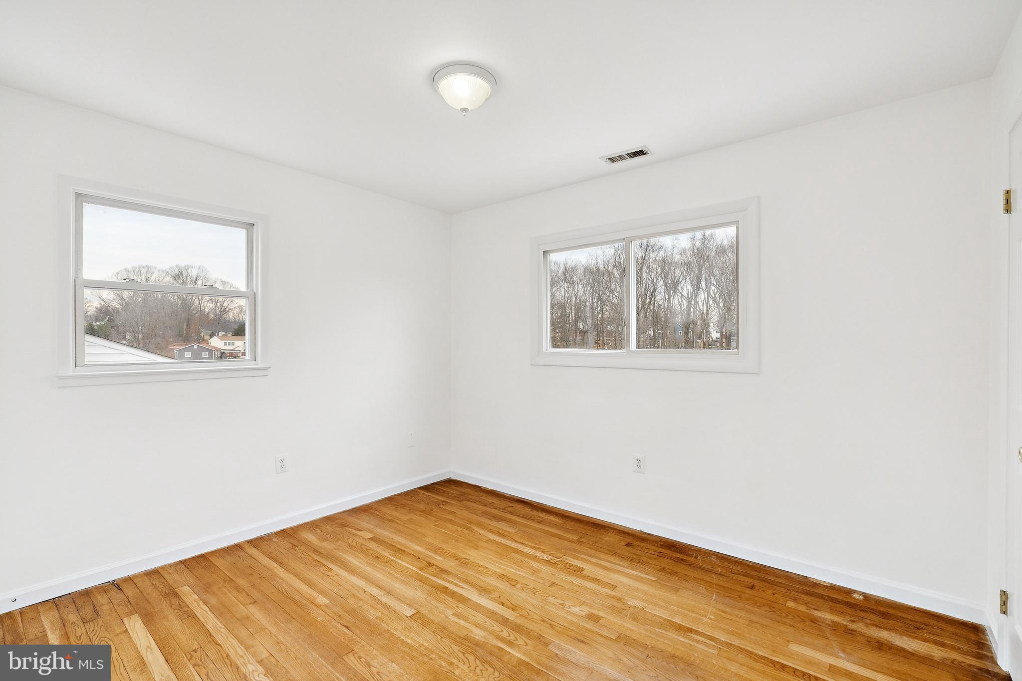 14508 Fullerton Road Woodbridge, VA 22193 - Photo 18 of 28 a view of empty room with wooden floor