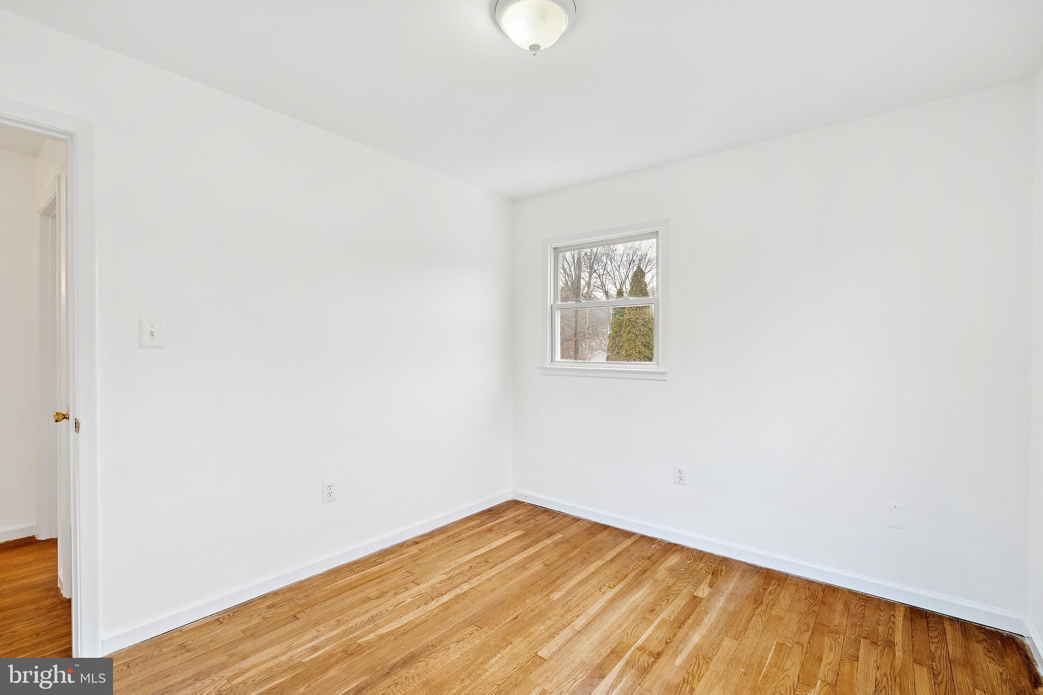 14508 Fullerton Road Woodbridge, VA 22193 - Photo 19 of 28 a view of empty room with wooden floor