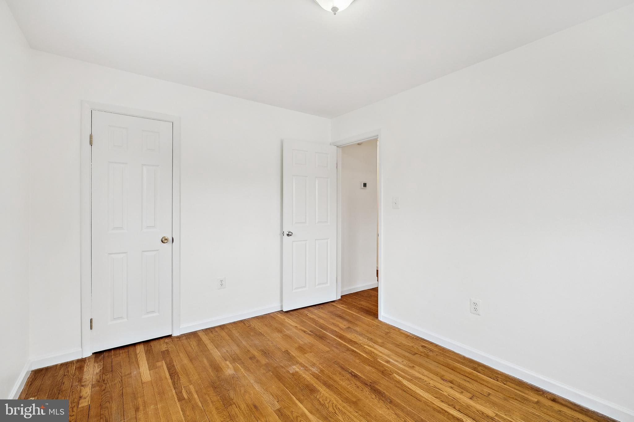 14508 Fullerton Road Woodbridge, VA 22193 - Photo 20 of 28 a view of an empty room with wooden floor