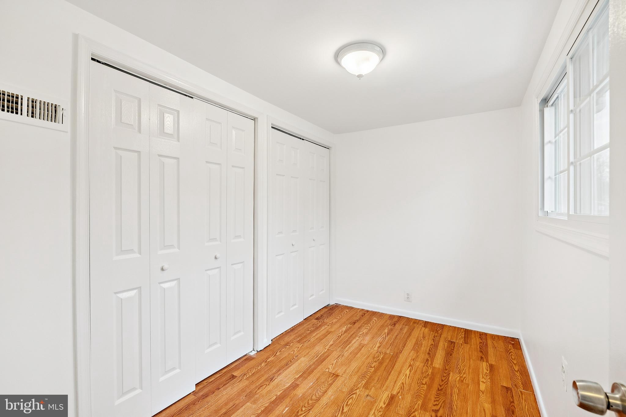 14508 Fullerton Road Woodbridge, VA 22193 - Photo 4 of 28 a view of empty room with wooden floor