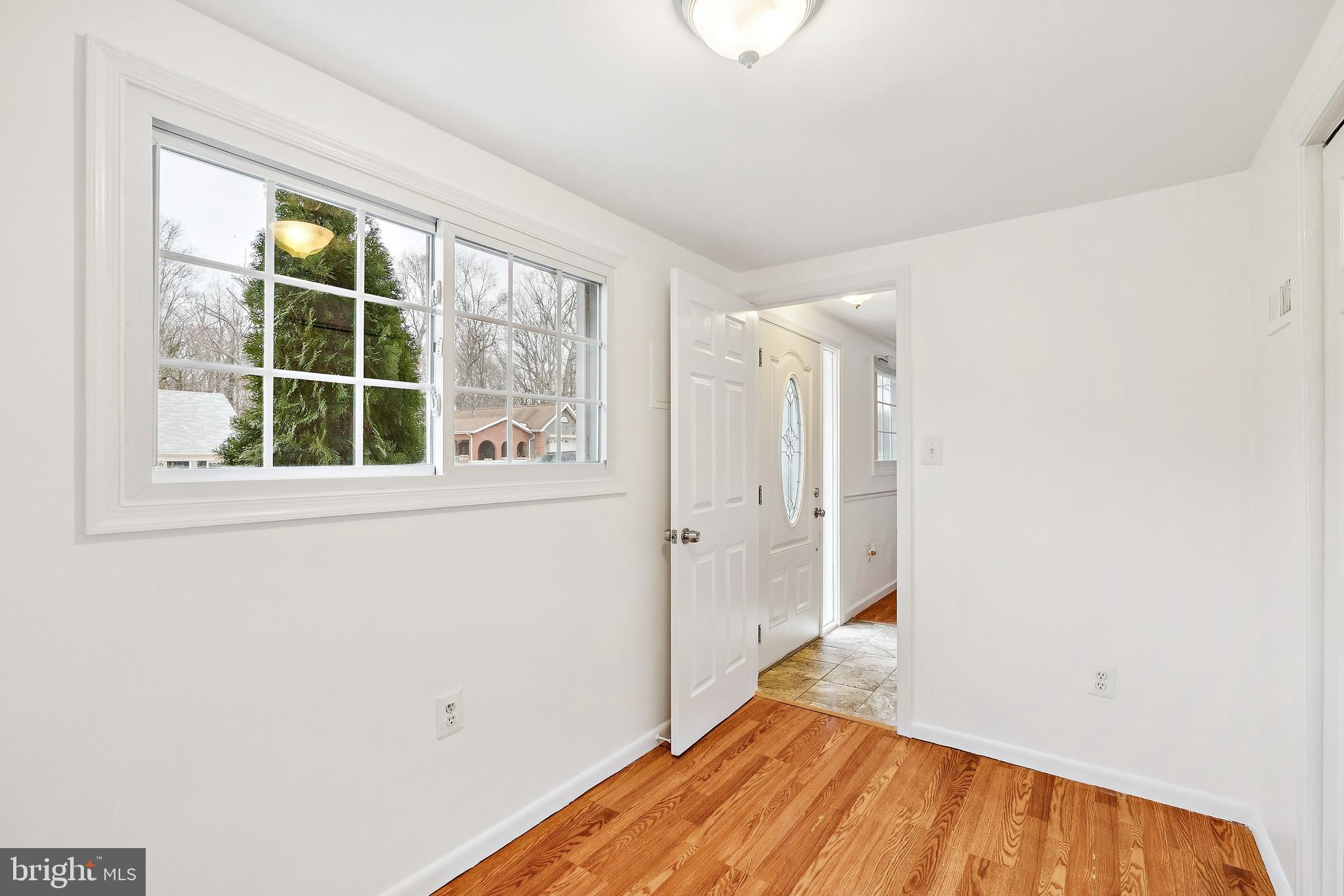 14508 Fullerton Road Woodbridge, VA 22193 - Photo 5 of 28 a view of empty room with wooden floor and fan