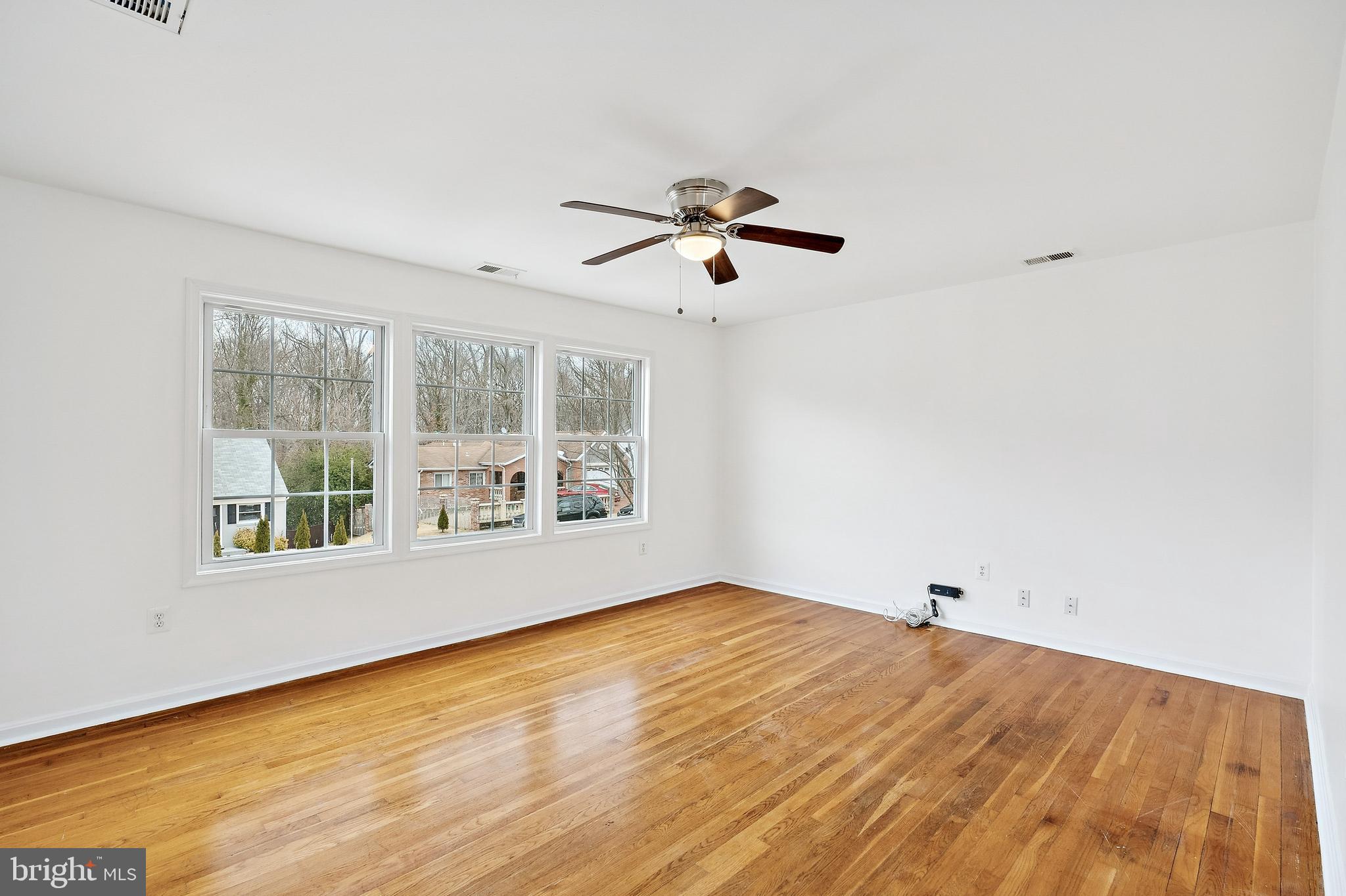 14508 Fullerton Road Woodbridge, VA 22193 - Photo 6 of 28 a view of empty room with wooden floor and fan