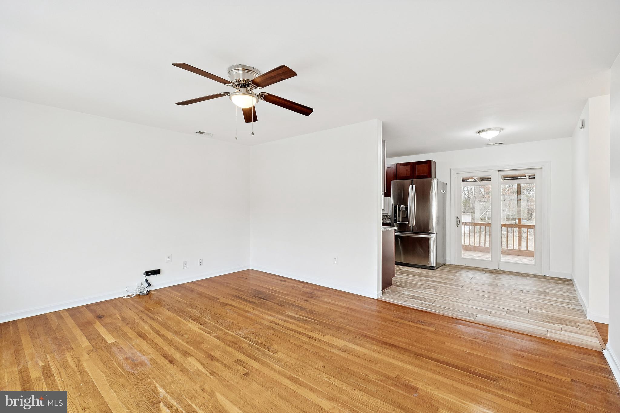 14508 Fullerton Road Woodbridge, VA 22193 - Photo 7 of 28 a view of empty room with wooden floor