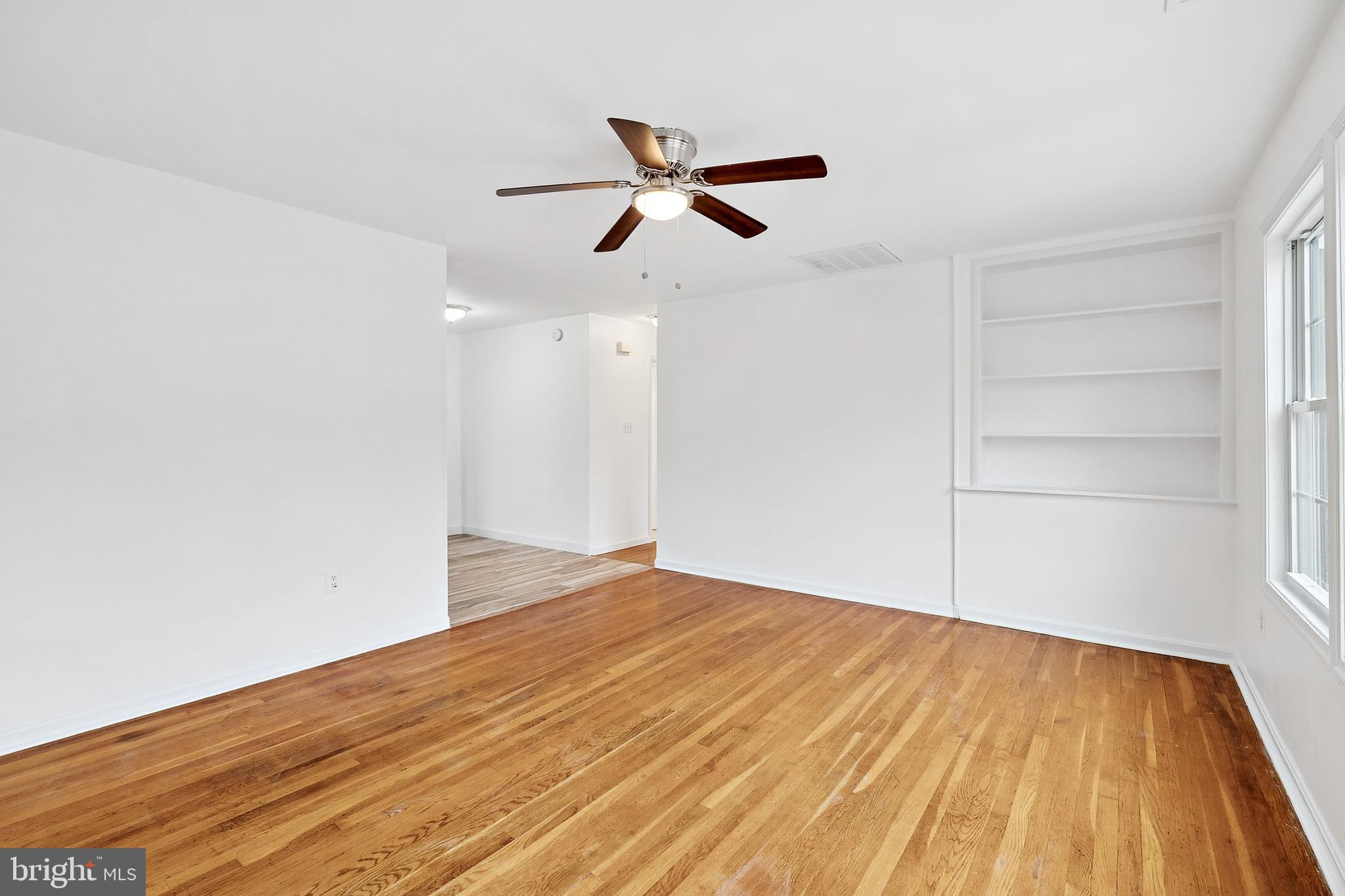 14508 Fullerton Road Woodbridge, VA 22193 - Photo 8 of 28 a view of empty room with wooden floor and ceiling fan