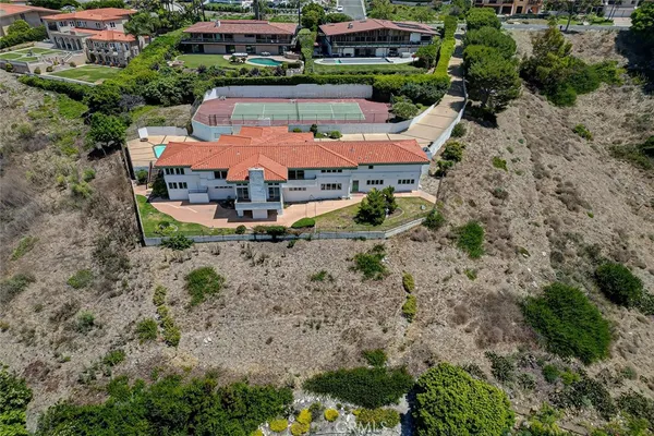an aerial view of a house with yard swimming pool and outdoor seating