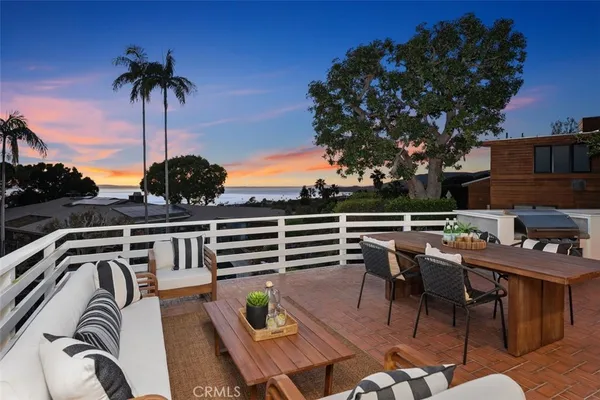a view of a chairs and table in patio