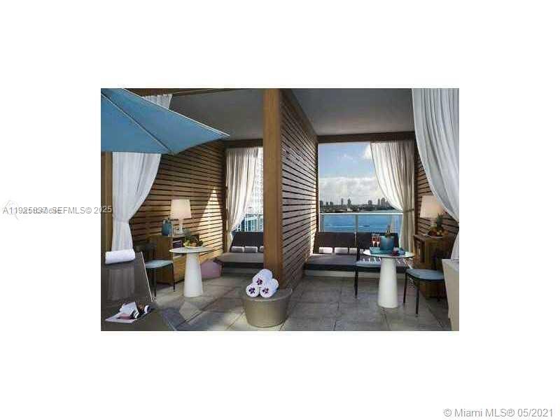 200 Biscayne Blvd Way, Unit 4309 Miami, FL 33131 - Photo 10 of 10 a living room with furniture and a window