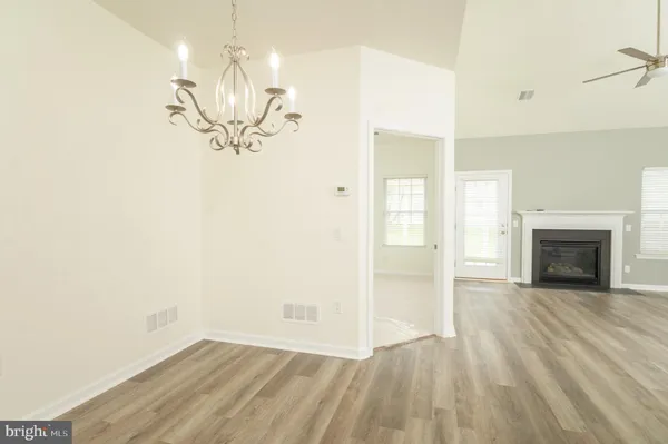 wooden floor in a hall with a window