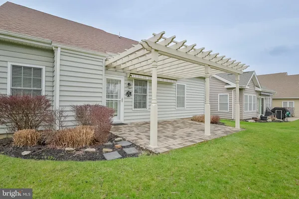 a view of a house with a yard and plants