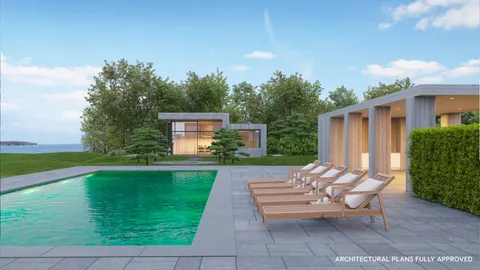 a view of a house with backyard sitting area and garden