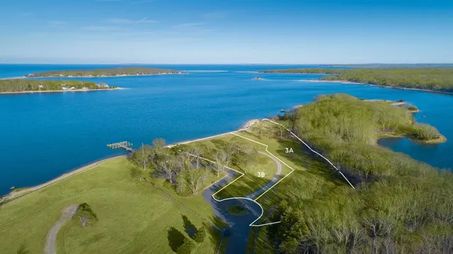 an aerial view of a house with a swimming pool