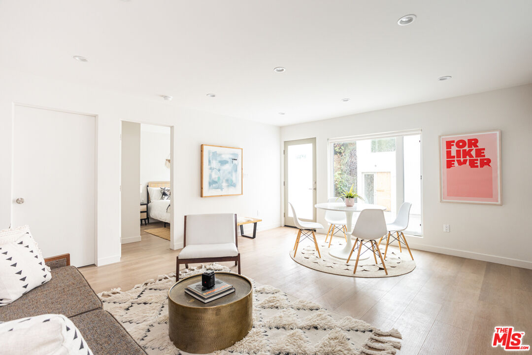 1948 1/2 Preston Avenue Los Angeles, CA 90026 - Photo 1 of 10 a living room with furniture and a table