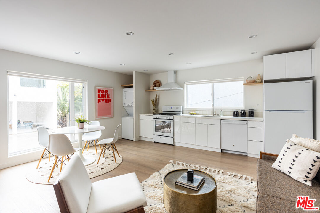 1948 1/2 Preston Avenue Los Angeles, CA 90026 - Photo 2 of 10 a living room with furniture and a large window