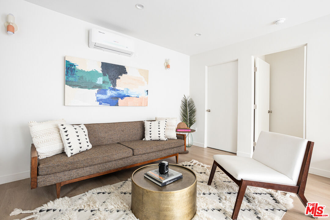 1948 1/2 Preston Avenue Los Angeles, CA 90026 - Photo 4 of 10 a living room with furniture and a potted plant