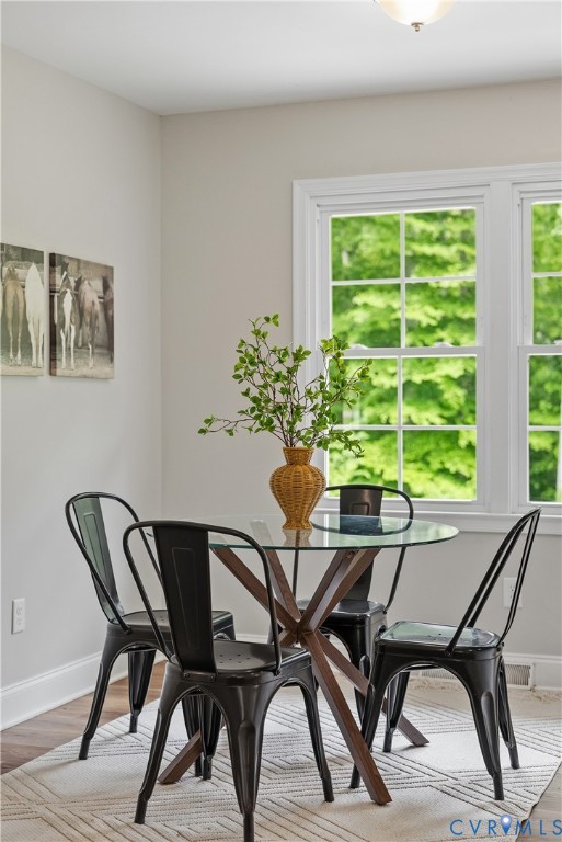81 Rock Creek Road Cumberland, VA 23040 - Photo 11 of 45 a view of a dining room with furniture and a potted plant