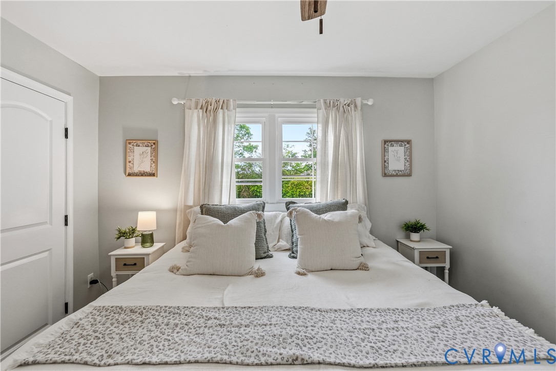 81 Rock Creek Road Cumberland, VA 23040 - Photo 15 of 45 a large bedroom with a bed and wooden floor