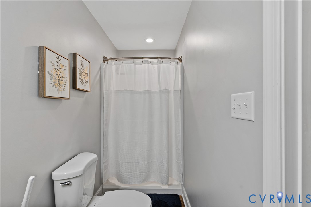 81 Rock Creek Road Cumberland, VA 23040 - Photo 18 of 45 a bathroom with a toilet and a shower