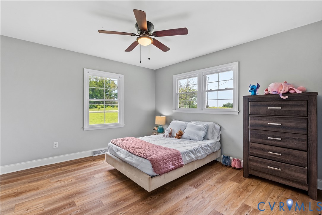 81 Rock Creek Road Cumberland, VA 23040 - Photo 19 of 45 a bedroom with a bed and a ceiling fan
