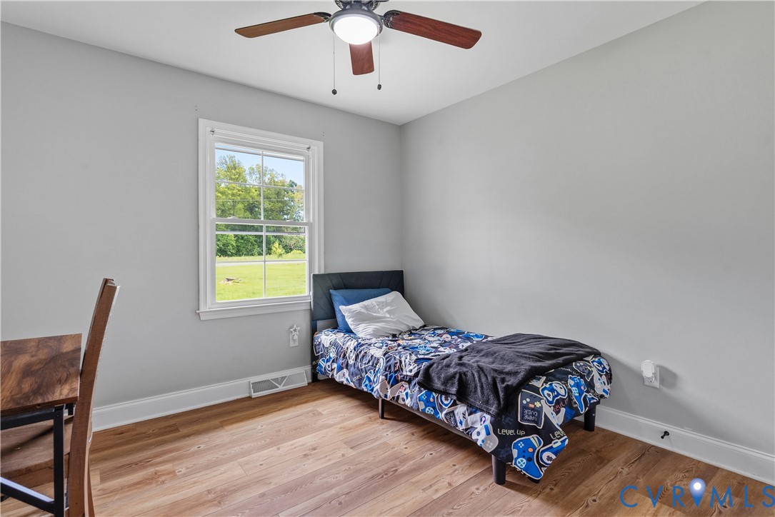 81 Rock Creek Road Cumberland, VA 23040 - Photo 21 of 45 a bedroom with a bed window and a desk