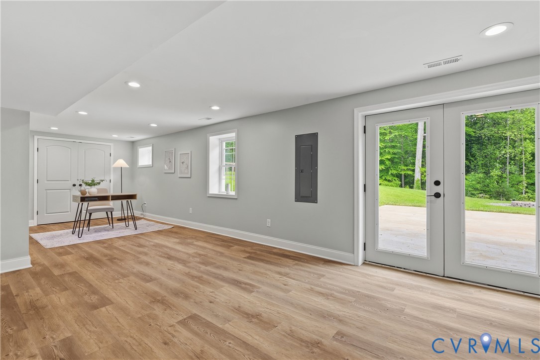 81 Rock Creek Road Cumberland, VA 23040 - Photo 29 of 45 a view of an empty room with a window and wooden floor