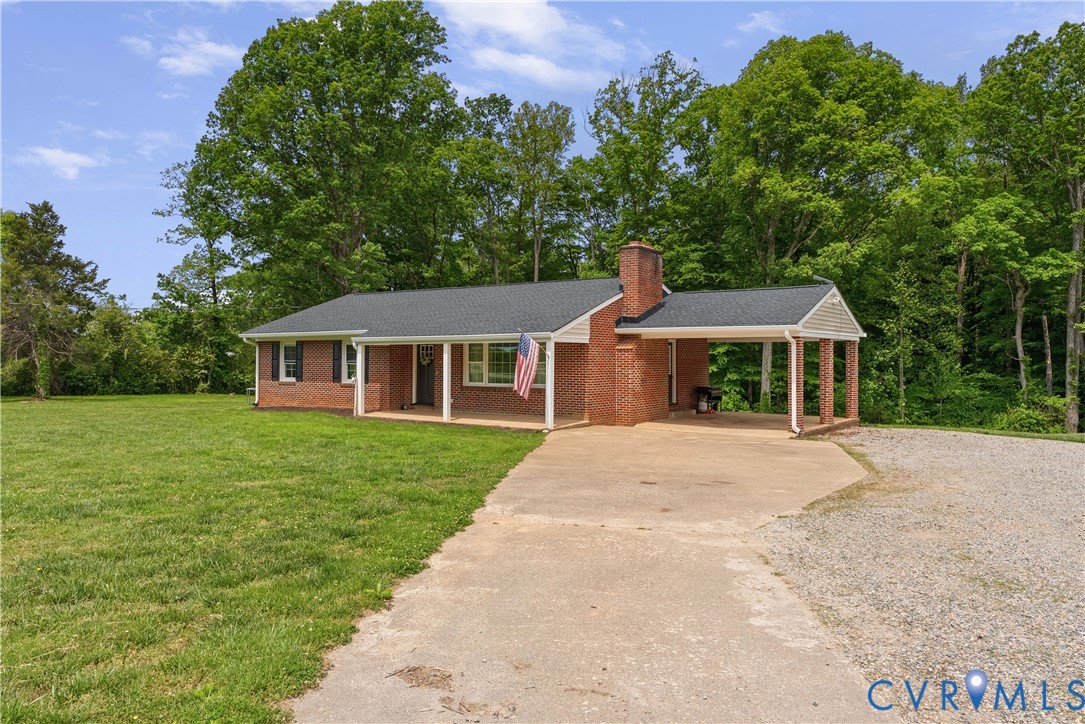 81 Rock Creek Road Cumberland, VA 23040 - Photo 3 of 45 a front view of a house with a yard