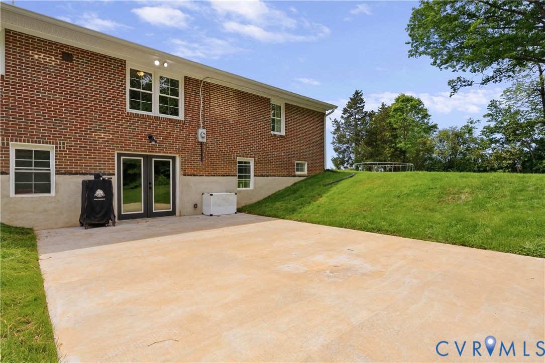 81 Rock Creek Road Cumberland, VA 23040 - Photo 34 of 45 a front view of a house with a yard and garage