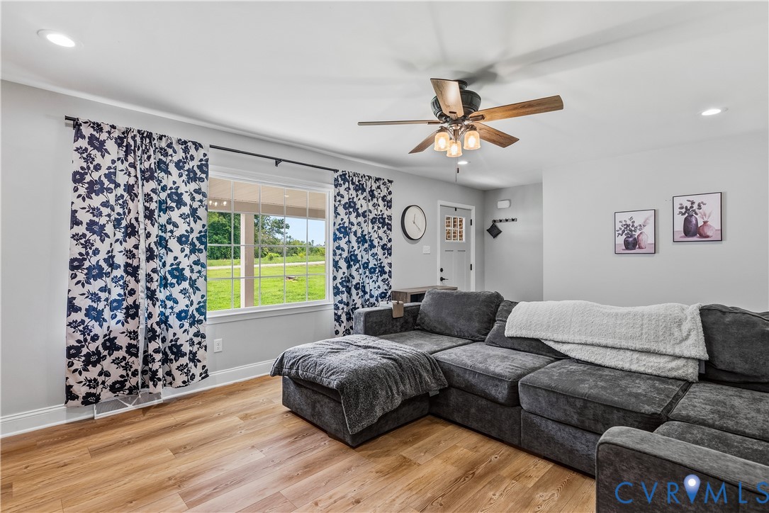 81 Rock Creek Road Cumberland, VA 23040 - Photo 6 of 45 a living room with furniture and a large window
