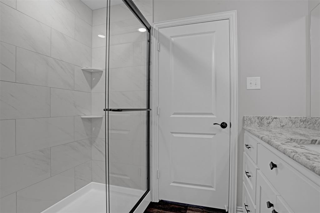 399 South Main Street Blue Ridge, TX 75424 - Photo 14 of 25 a bathroom with a shower and a sink