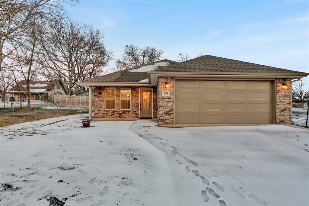 399 South Main Street Blue Ridge, TX 75424 - Photo 23 of 25 a front view of a house with a yard and garage