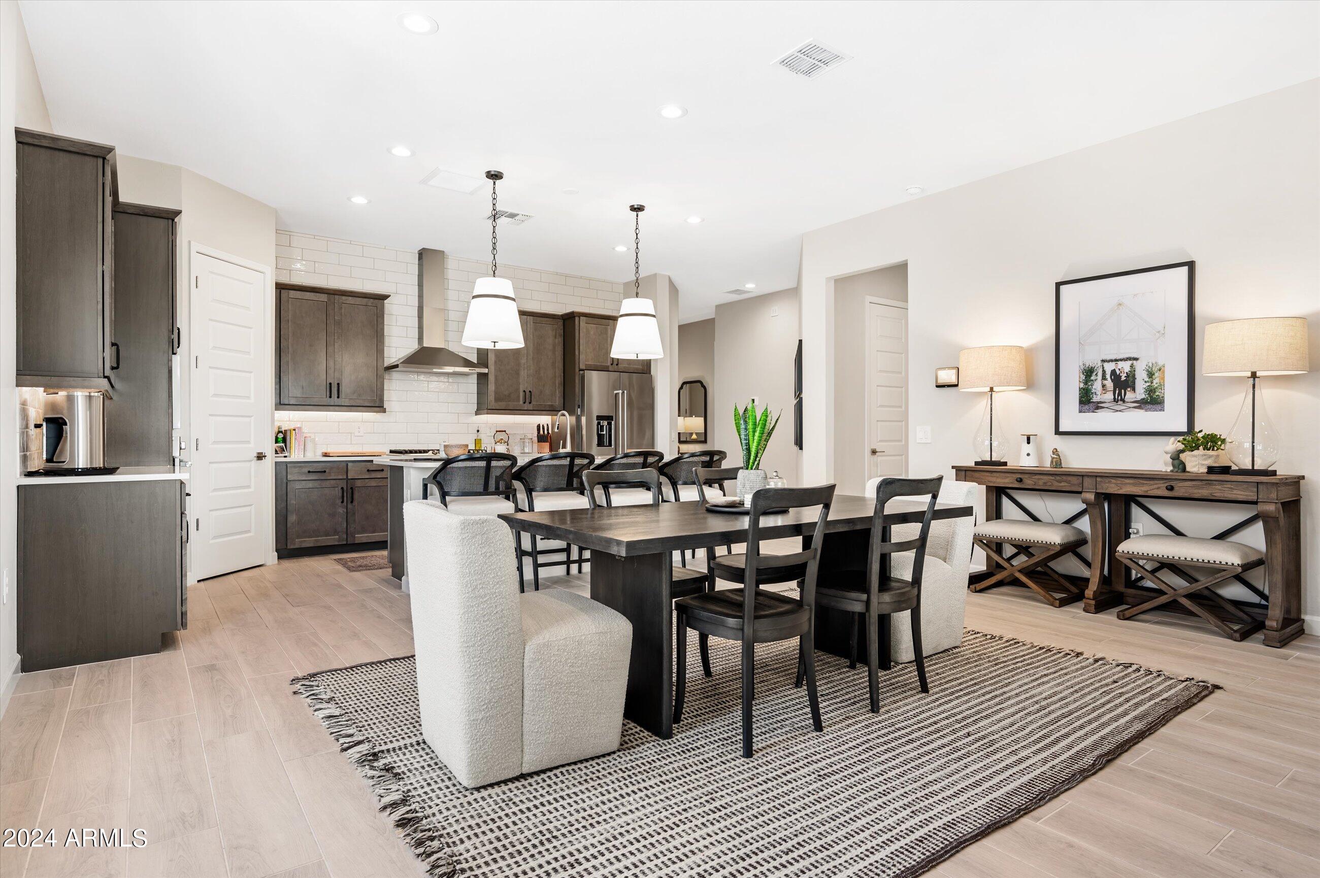 21425 North 59th Street Phoenix, AZ 85054 - Photo 11 of 47 a large kitchen with a table and chairs