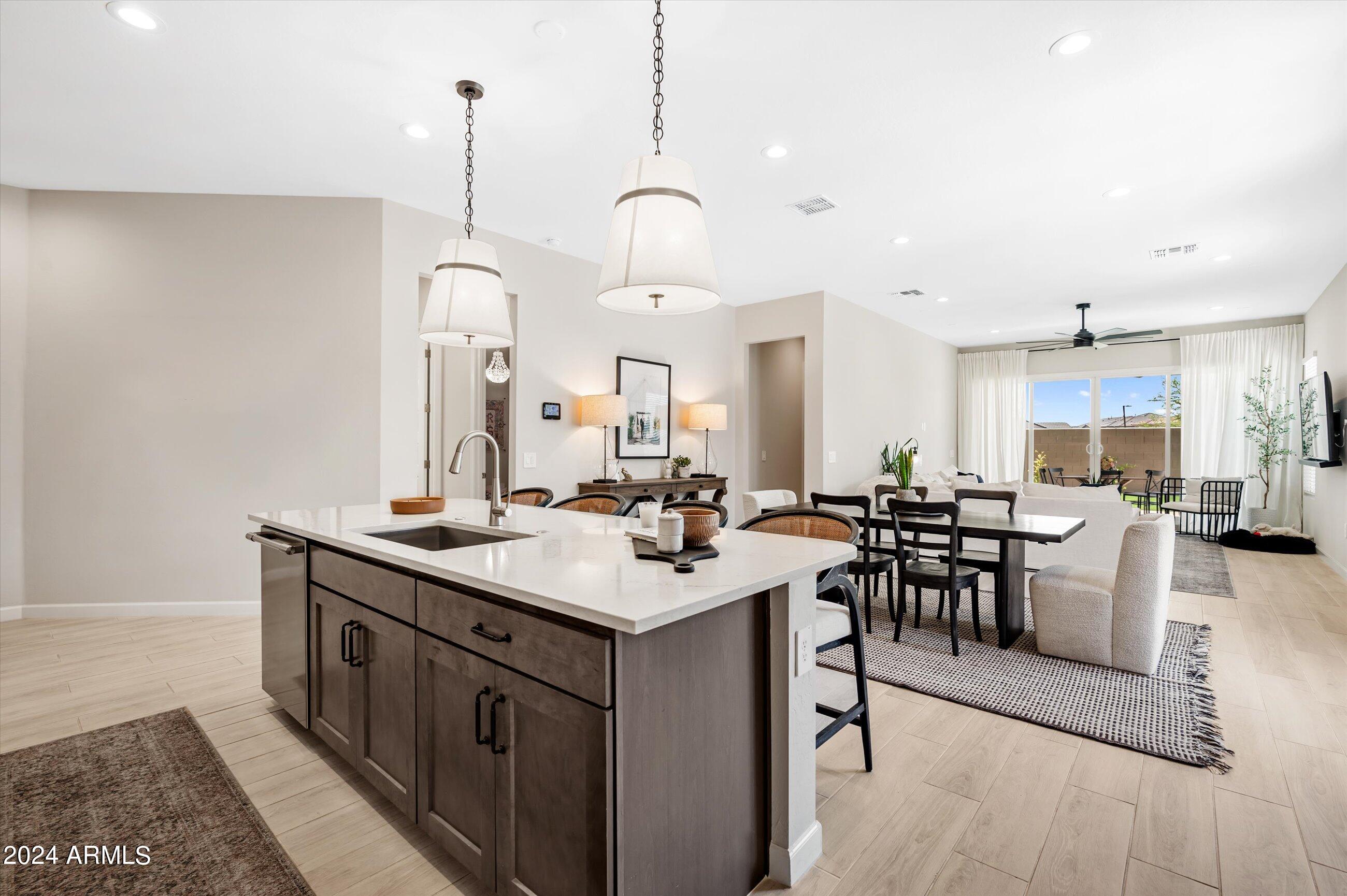 21425 North 59th Street Phoenix, AZ 85054 - Photo 13 of 47 a room with lots of wooden furniture a sink a dining table and chairs