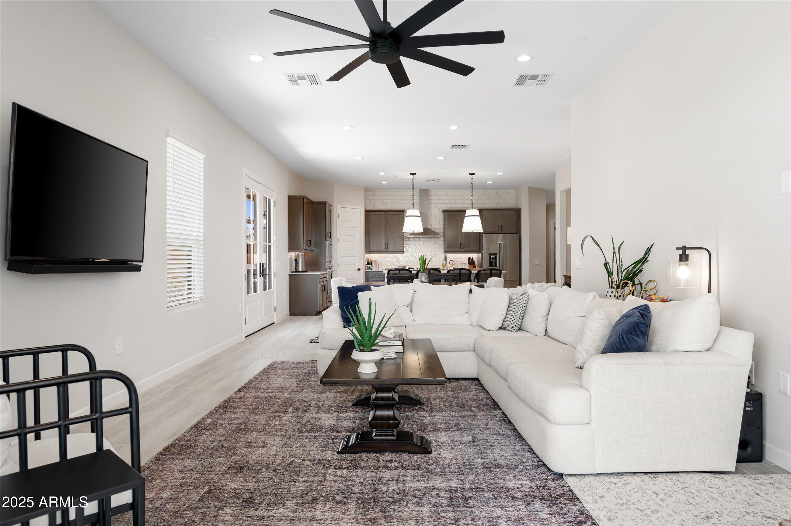 21425 North 59th Street Phoenix, AZ 85054 - Photo 15 of 47 a living room with furniture and a flat screen tv