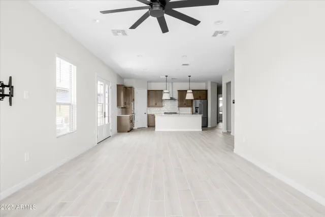 a view of a kitchen with furniture and windows