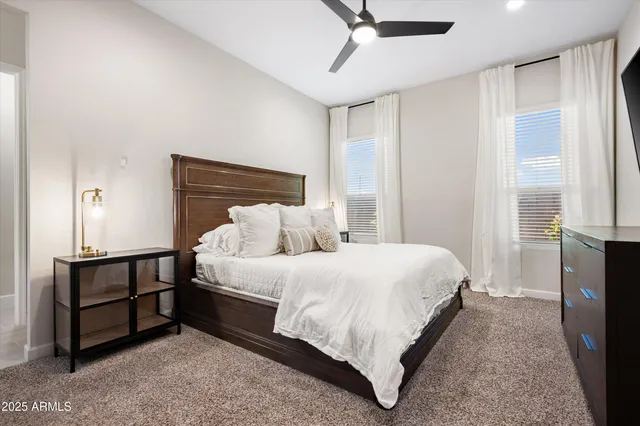 a bed room with a bed and a tv