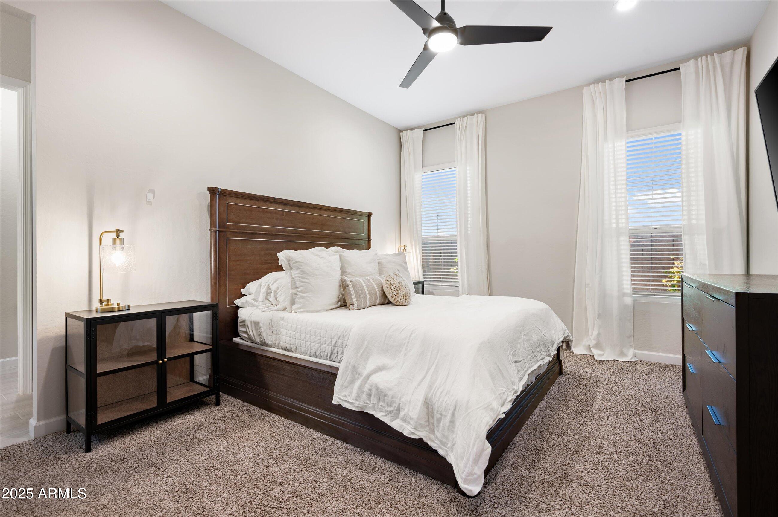 21425 North 59th Street Phoenix, AZ 85054 - Photo 20 of 47 a bed room with a bed and a tv