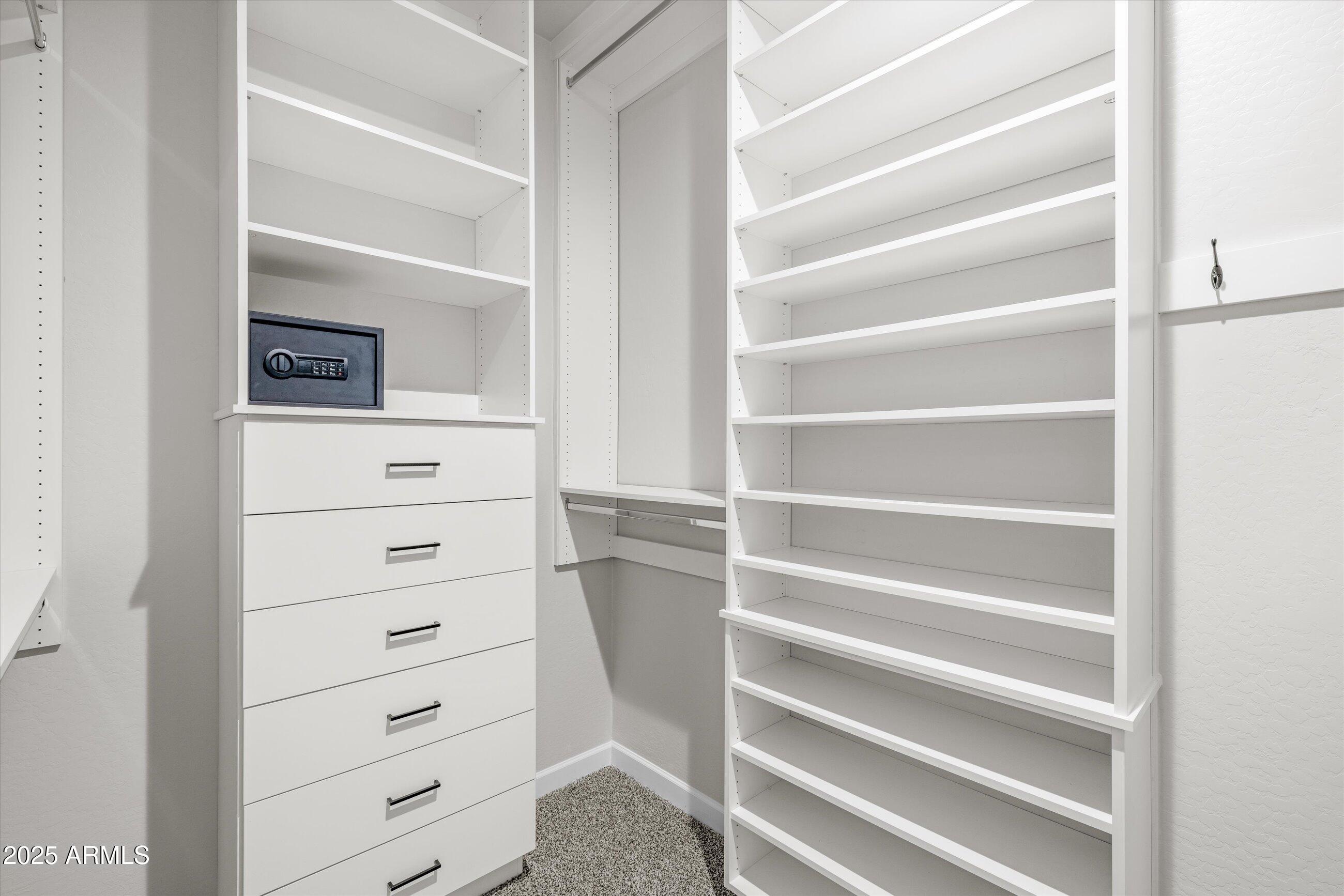 21425 North 59th Street Phoenix, AZ 85054 - Photo 23 of 47 a view of walk in closet with clothes