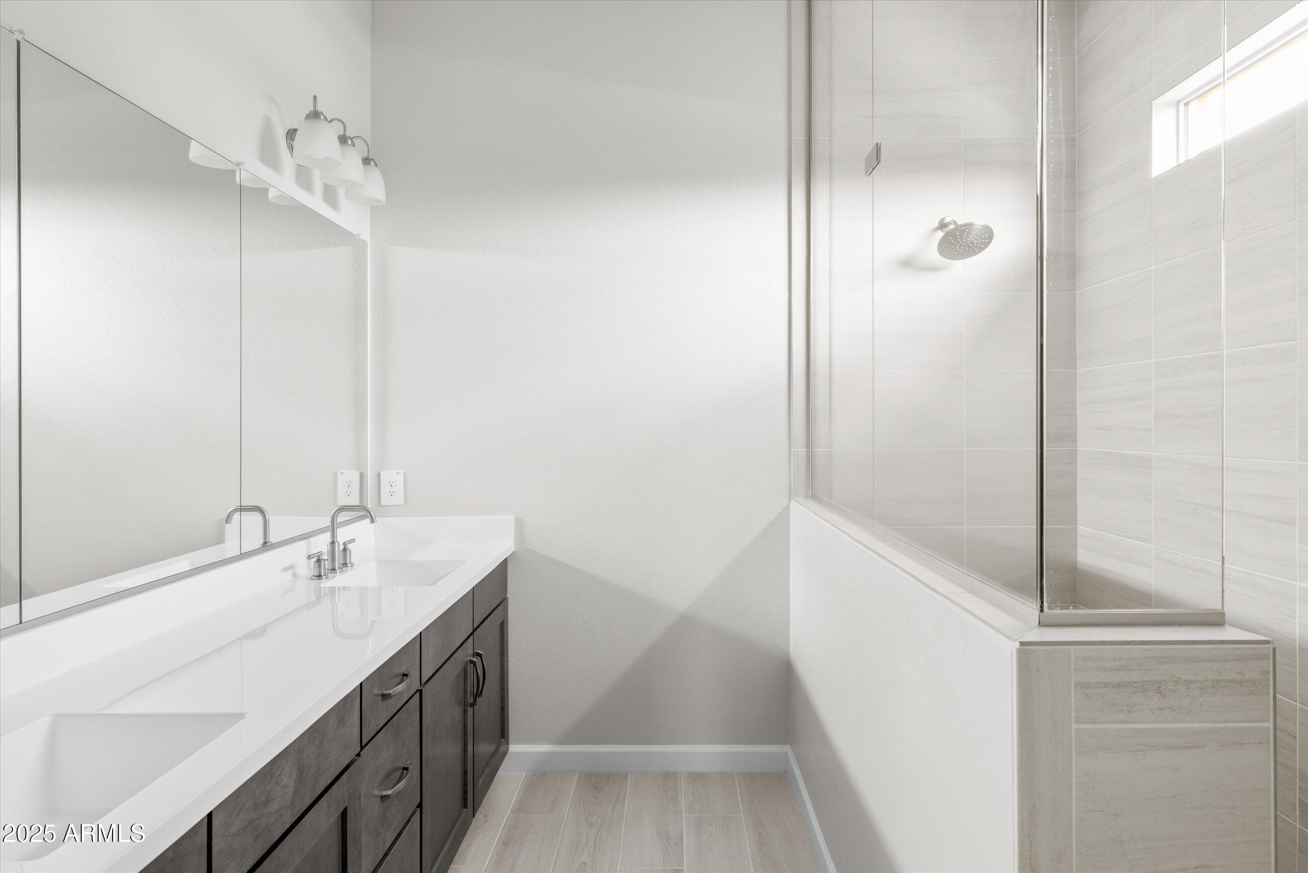 21425 North 59th Street Phoenix, AZ 85054 - Photo 24 of 47 a bathroom with a tub sink and mirror