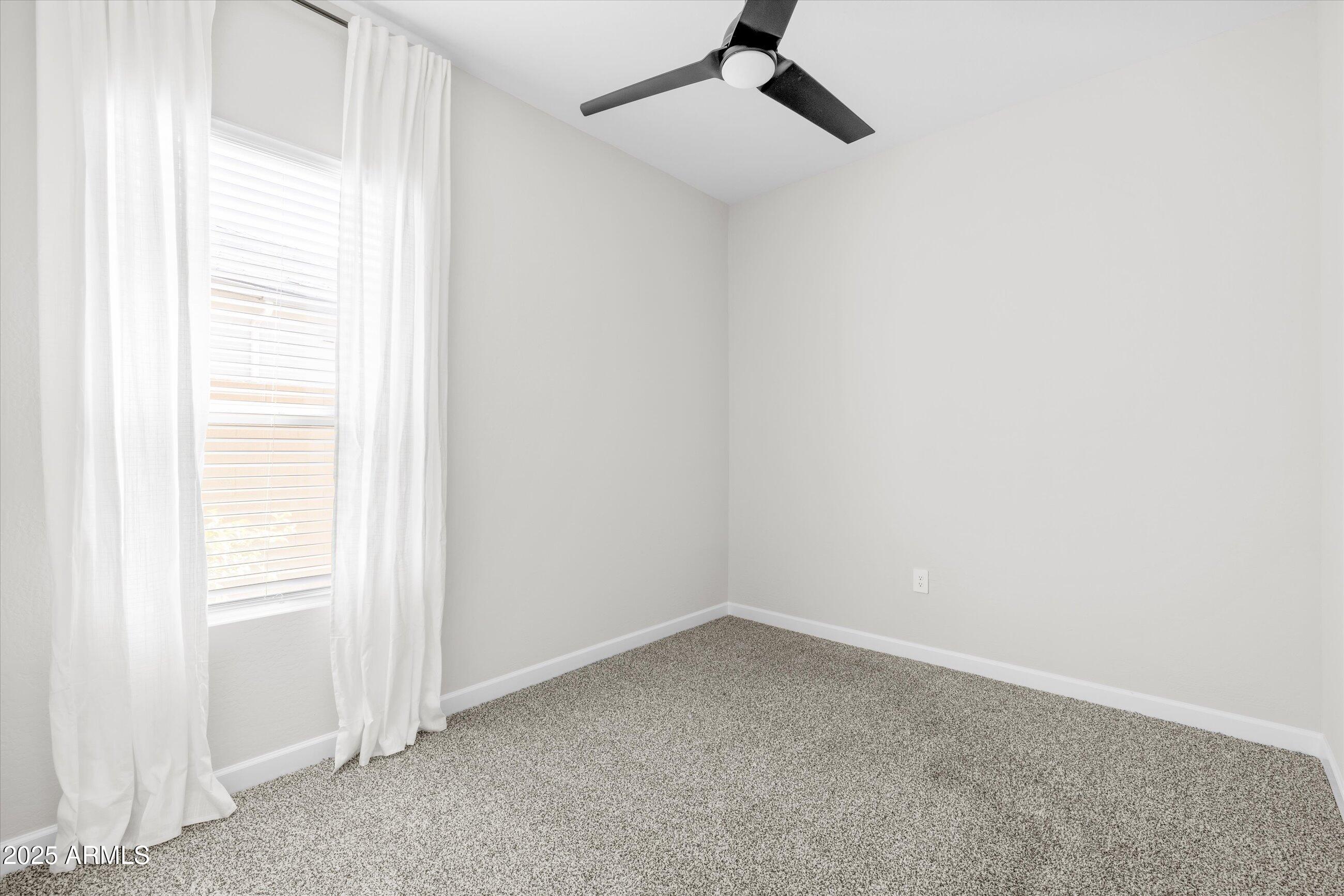 21425 North 59th Street Phoenix, AZ 85054 - Photo 30 of 47 an empty room with a window