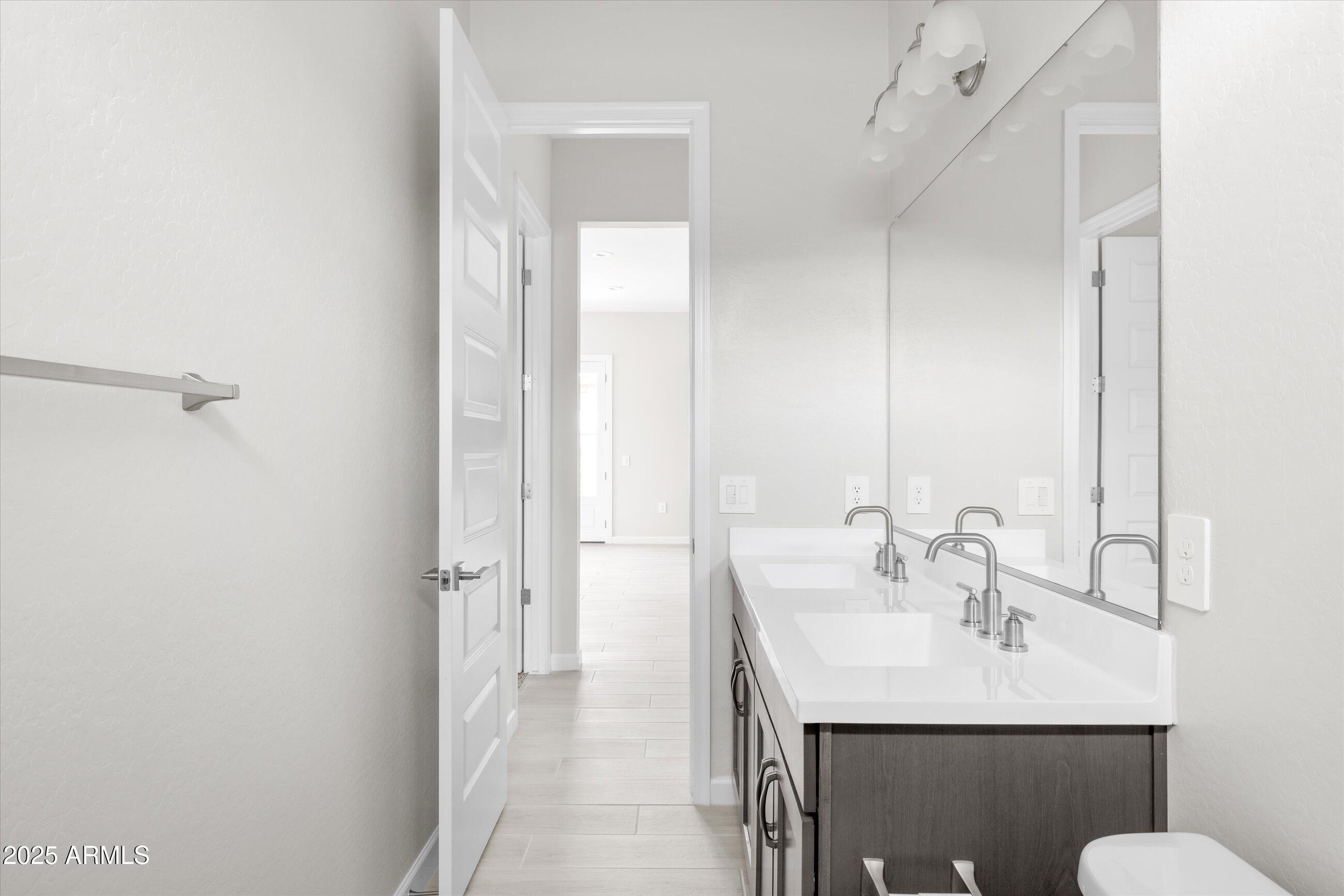 21425 North 59th Street Phoenix, AZ 85054 - Photo 32 of 47 a bathroom with a sink and a mirror