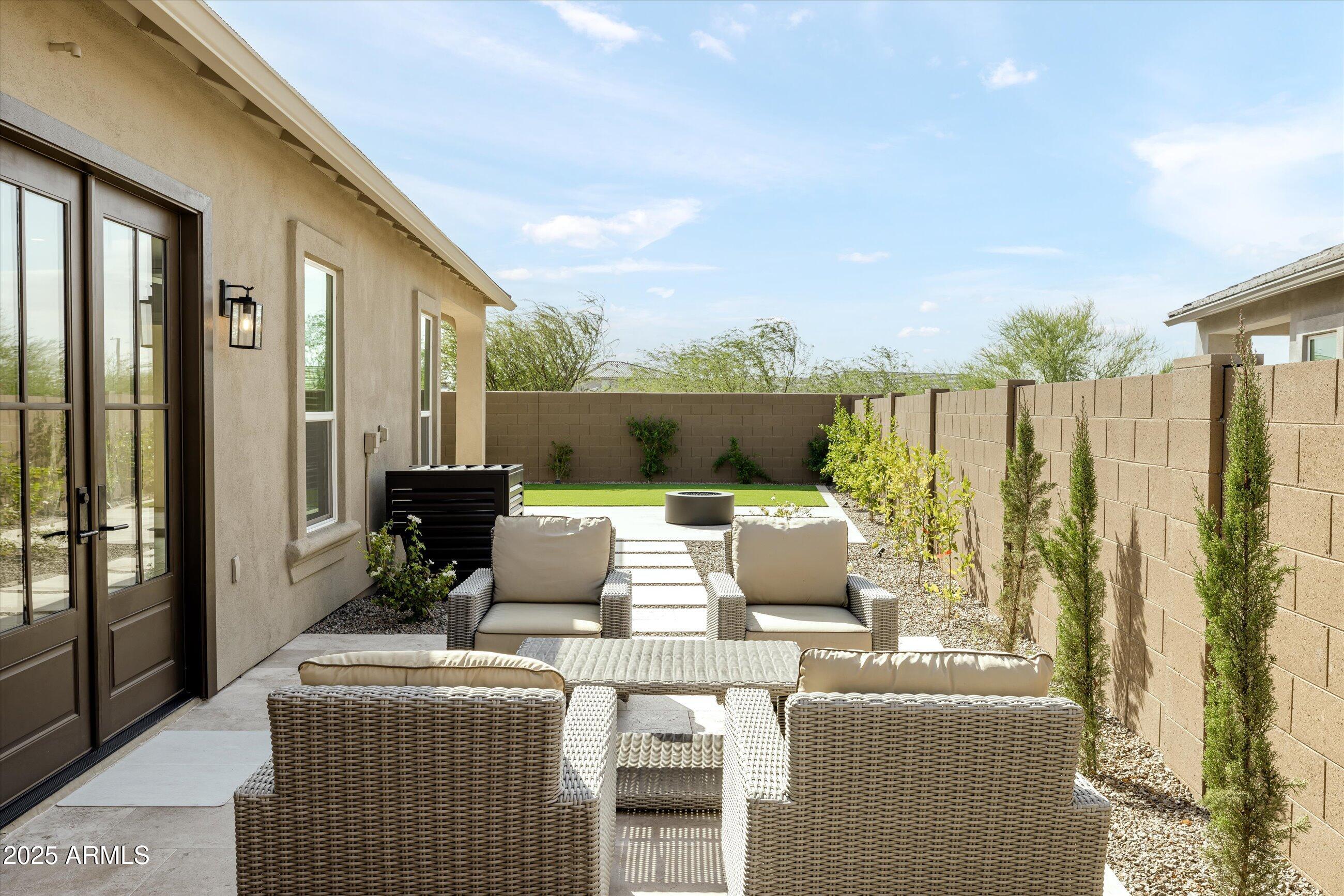21425 North 59th Street Phoenix, AZ 85054 - Photo 39 of 47 a outdoor living space with furniture and garden view