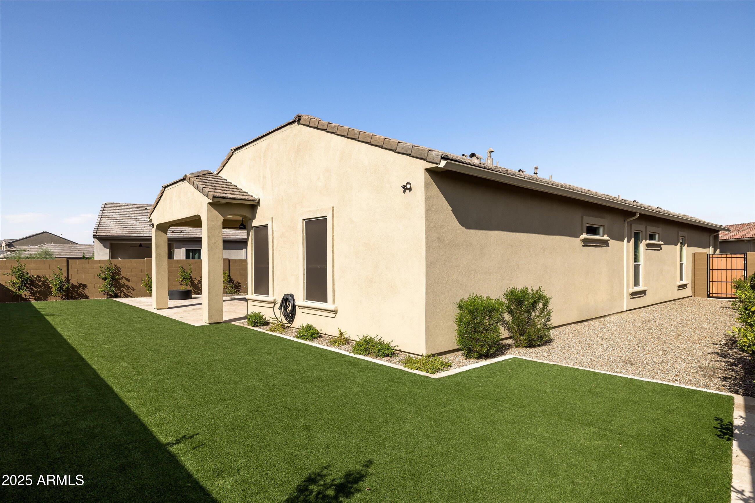 21425 North 59th Street Phoenix, AZ 85054 - Photo 40 of 47 a front view of a house with a yard